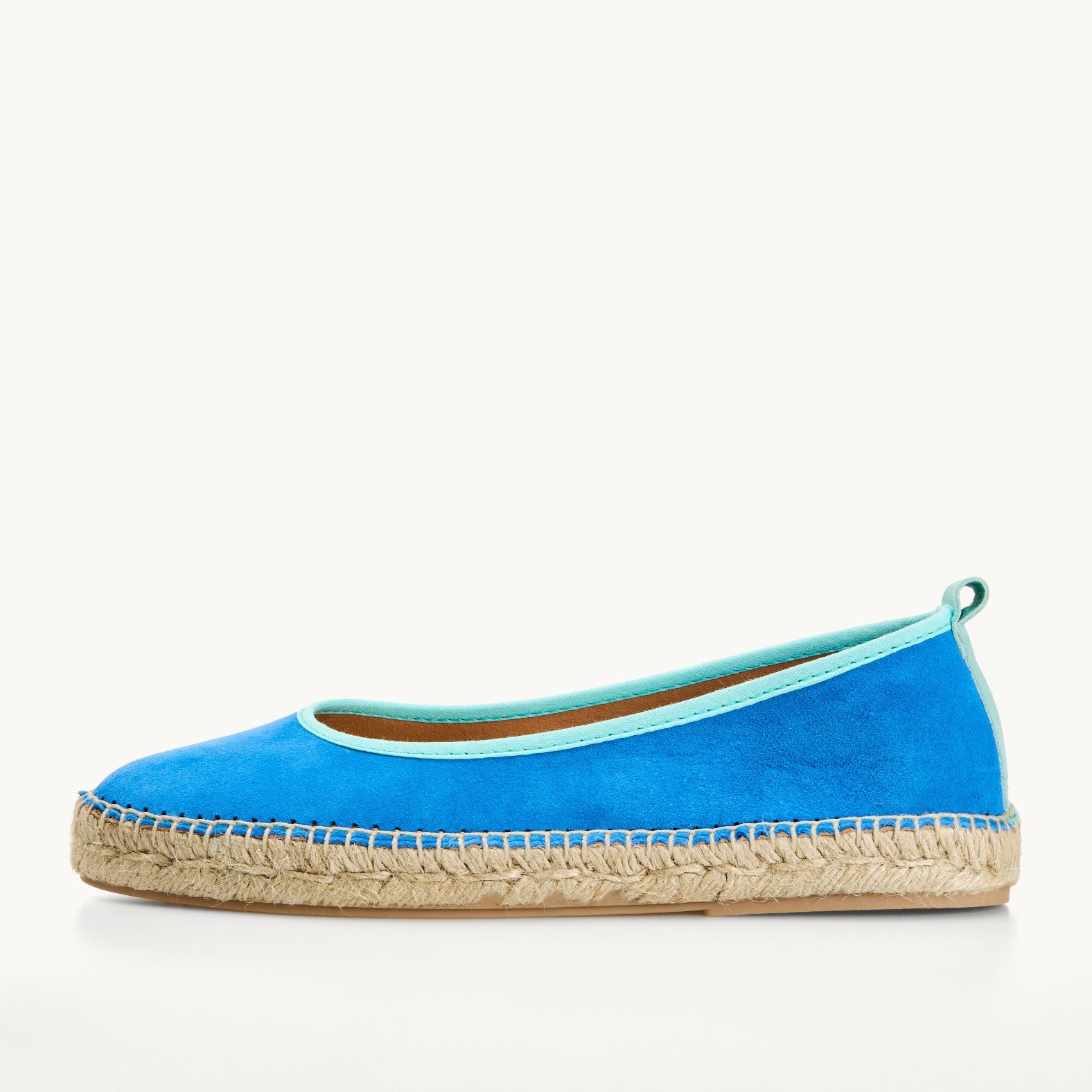 Ballet espadrilles. Flat shoes. Azure blue suede upper with duck egg light turquoise trim around the opening of the shoe with stitching around the edge joining the upper to the a traditional jute sole.